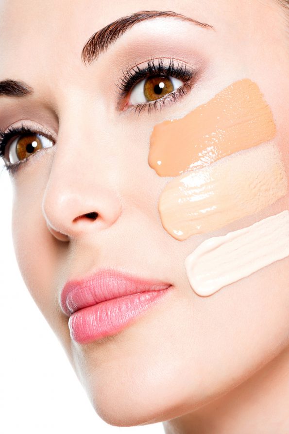 Beautiful face of woman with cosmetic foundation on a skin. کرم پودر